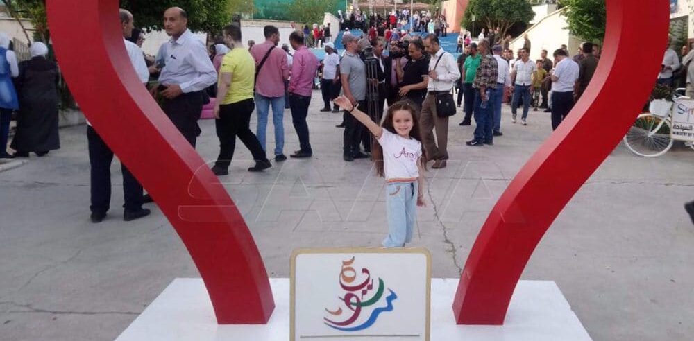 The photo shows visitors to the 42nd edition of Damascus International Flowers Fair in the Syrian capital on June 26, 2022. Photo by SANA.