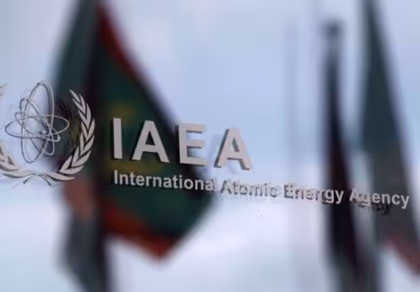 The logo of the International Atomic Energy Agency (IAEA) is seen outside the IAEA headquarters in Vienna, Austria, on March 1, 2021. Photo by Reuters.