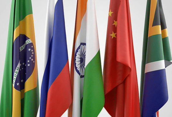 Flags and representatives of the BRICS countries and as well as those of other nations who aspire to join the group. Photo: AP.