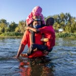 Seeking refuge: a Haitian family cross the Rio Grande into Texas, September 2021. John Moore · Getty