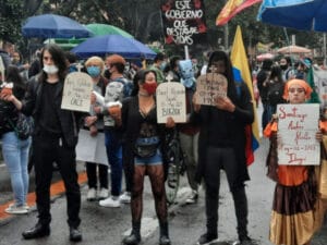 Young Colombian protesters holding placards with the names of protesters "disappeared" during Colombian general strike in 2021. Photo: AFGJ.