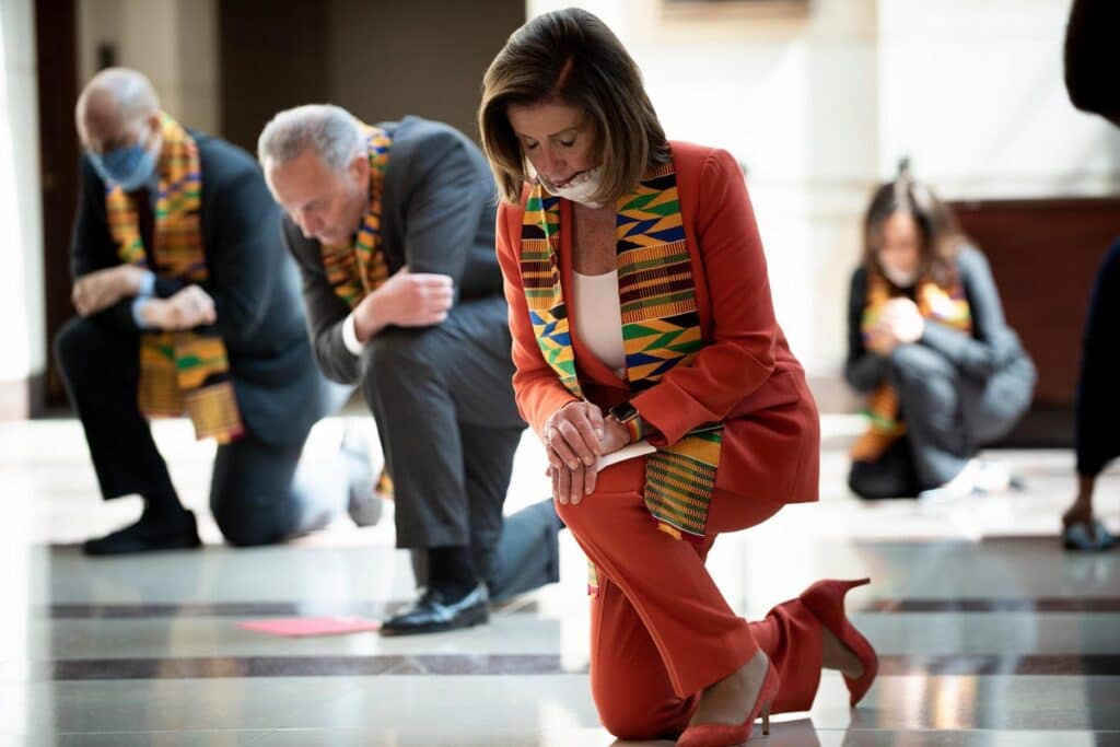 Nancy Pelosi and a group of US democratic party congress people kneel during a George Floyd memorial in 2020 in a very controversial photo op that did not go well. Photo: AFP via Getty Images.