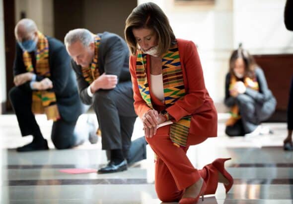 Nancy Pelosi and a group of US democratic party congress people kneel during a George Floyd memorial in 2020 in a very controversial photo op that did not go well. Photo: AFP via Getty Images.