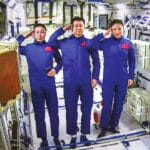 The Shenzhou-14 crew members, Chen Dong (center), Liu Yang (right) and Cai Xuzhe salute from the Wentian (Quest to The Heavens) lab module on July 25, 2022 from some 400 kilometers above the Earth. The three taikonauts checked in to their office and home unit in space at 10:03 am. Photo: cnsphoto.