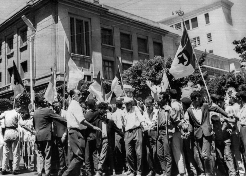 Young Algerians parade in front of the faculties in Algiers, waving Algerian flags and celebrating, on 2 July 1962, a day after the self-determination referendum on the independence of their country. Photo: AFP/File.