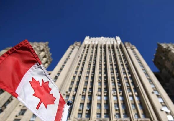 Ministry of Foreign Affairs of the Russian Federation, with the flag of Canada in the foreground. Photo: Sputnik.