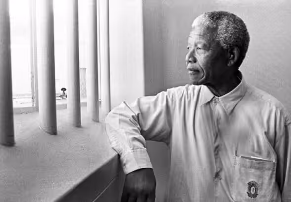 Nelson Mandela revisiting his jail cell in Robben Island Prison. File photo.