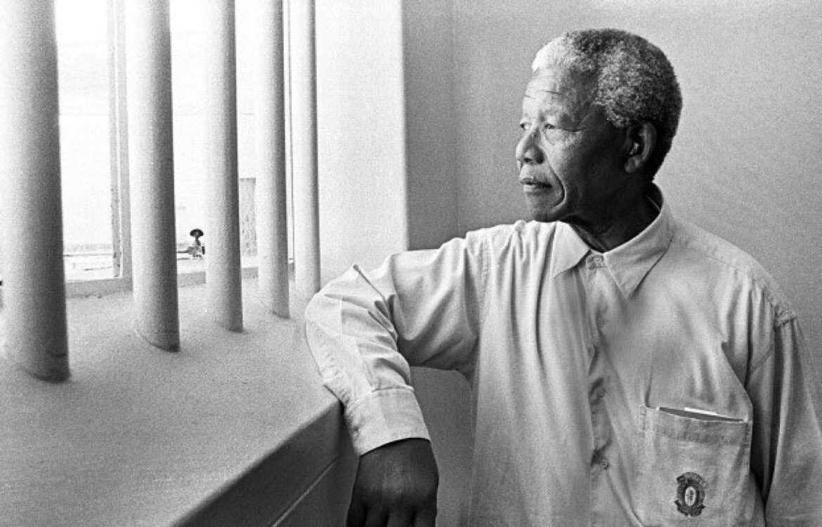 Nelson Mandela revisiting his jail cell in Robben Island Prison. File photo.