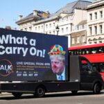 A mobile advertising board, featuring UK Prime Minister Boris Johnson dressed as a clown, drives near Downing Street in London, the United Kingdom. Photo: Phil Noble/Reuters.