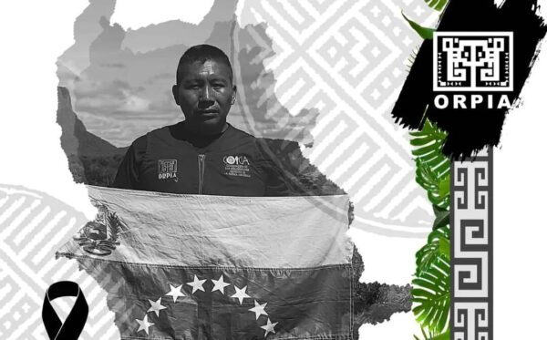 Graphic showing indigenous land defender Virgilio Trujillo Arana holding a Venezuelan flag. Photo: ORPIA.
