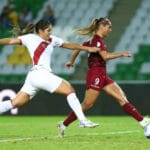 Venezuela's Deyna Castellanos runs with the ball while a Peruvian player chases her, seconds before scoring the first goal. Photo: Twitter/@CopaAmerica.