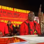 South African Communist Party leader Solly Mapaila (right) with a statuette of Hugo Chávez, gifted by the PSUV, sitting with other members of SACP. Photo: Twitter/@PartidoPSUV