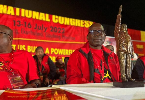 South African Communist Party leader Solly Mapaila (right) with a statuette of Hugo Chávez, gifted by the PSUV, sitting with other members of SACP. Photo: Twitter/@PartidoPSUV