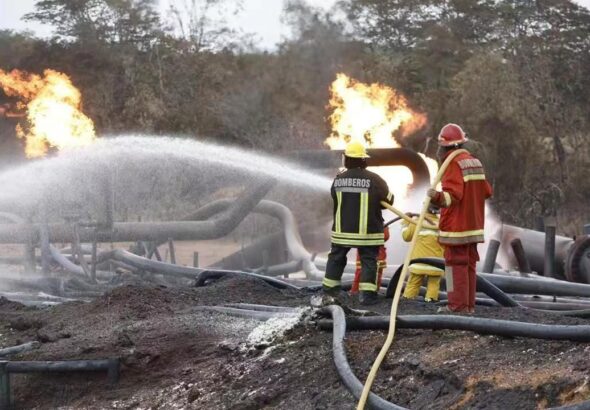 Firemen extinguishing some remaining flames on the site of sabotage. Photo: Twitter/@MinPetroleVE.