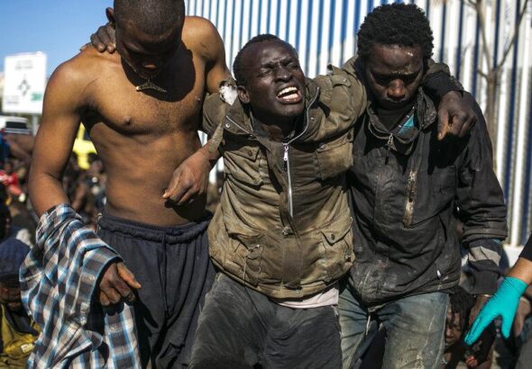 Surviving migrants arrive at a holding center after crossing the fences separating the Spanish enclave of Melilla from Morocco on Wednesday, March 2, 2022.  Photo: AP/Javier Bernardo.