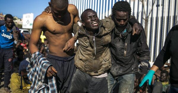 Surviving migrants arrive at a holding center after crossing the fences separating the Spanish enclave of Melilla from Morocco on Wednesday, March 2, 2022.  Photo: AP/Javier Bernardo.