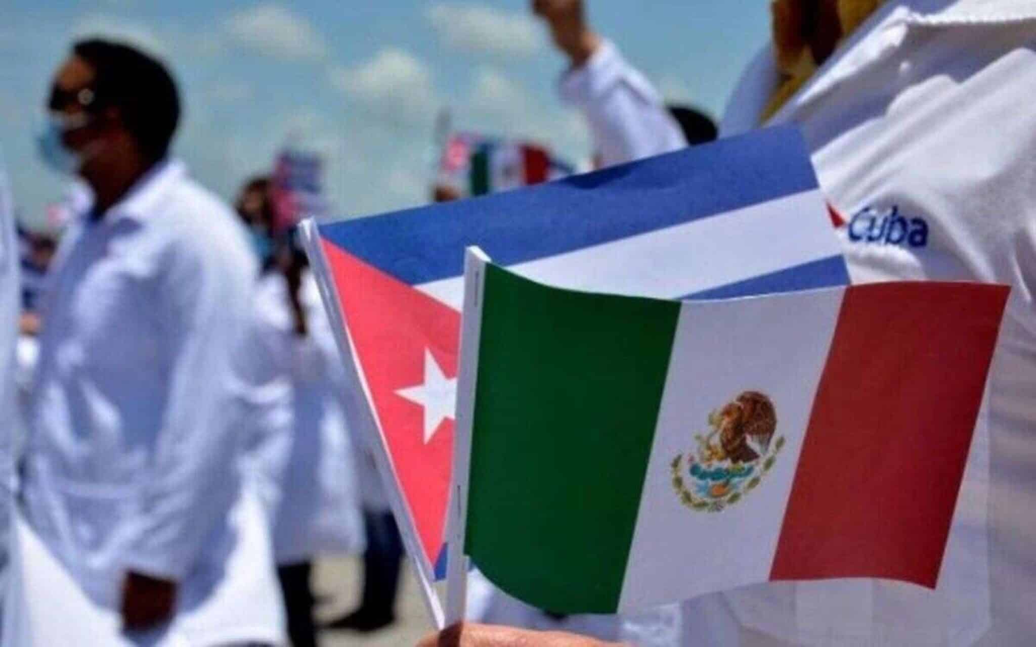 A Cuban doctor holding flags of Mexico and Cuba during a public ceremony. File photo.