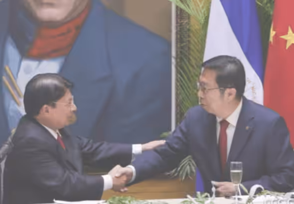 Nicaraguan Foreign Affairs Minister Denis Moncada shakes hands with the Ambassador of China in Nicaragua, Chen Xi. Photo: El19Digital.
