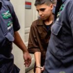 Palestinian prisoner Ahmed Manasra, who is suffering from mental health disorders due to torture in Israeli prison, being escorted by Israeli police. Photo: IMEMC.