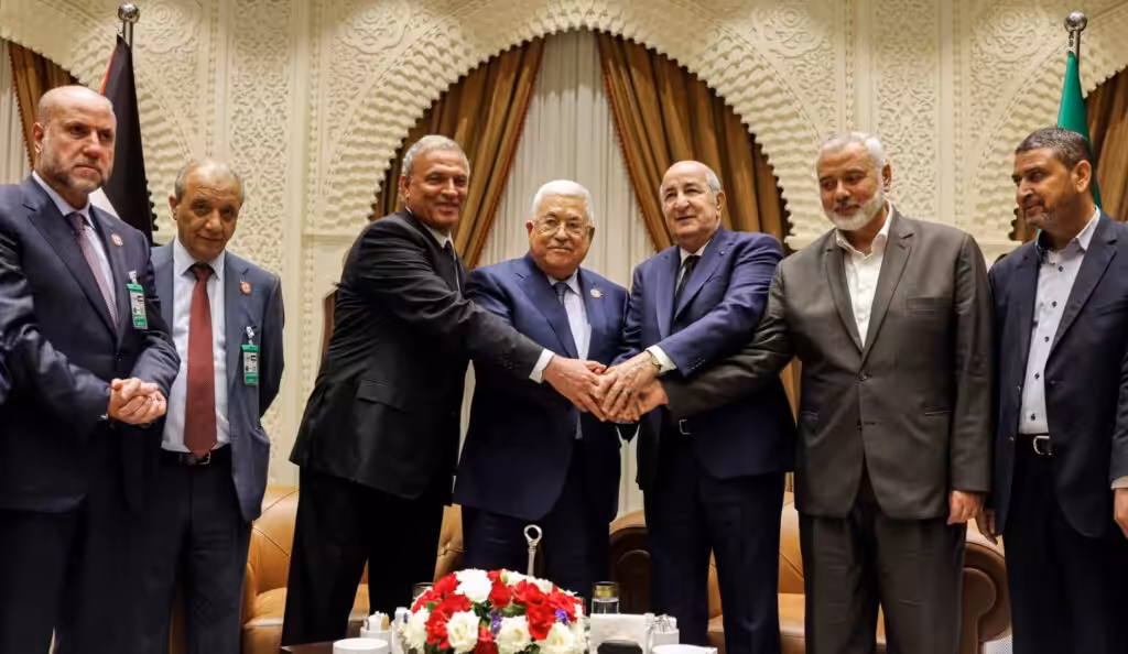 Palestinian president Mahmud Abbas (center) meets Algerian President Abdelmajid Tebboune (center right) and Palestinian Hamas movement's leader Ismail Haniyeh (2nd right) in Algiers, Algeria, on July 5, 2022. Photo: Thaer Ghanaim/AFP/Handout/PPO.