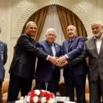 Palestinian president Mahmud Abbas (center) meets Algerian President Abdelmajid Tebboune (center right) and Palestinian Hamas movement's leader Ismail Haniyeh (2nd right) in Algiers, Algeria, on July 5, 2022. Photo: Thaer Ghanaim/AFP/Handout/PPO.
