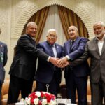 Palestinian president Mahmud Abbas (center) meets Algerian President Abdelmajid Tebboune (center right) and Palestinian Hamas movement's leader Ismail Haniyeh (2nd right) in Algiers, Algeria, on July 5, 2022. Photo: Thaer Ghanaim/AFP/Handout/PPO.