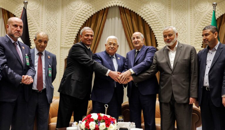 Palestinian president Mahmud Abbas (center) meets Algerian President Abdelmajid Tebboune (center right) and Palestinian Hamas movement's leader Ismail Haniyeh (2nd right) in Algiers, Algeria, on July 5, 2022. Photo: Thaer Ghanaim/AFP/Handout/PPO.