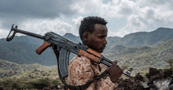 Man with a weapon over his shoulder. File photo.