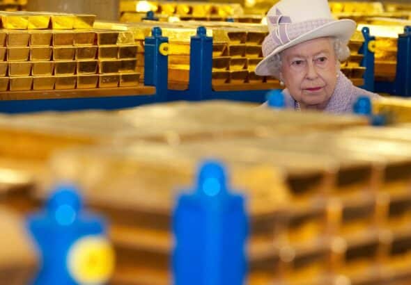 Queen Elizabeth of Britain tours a gold vault during a visit to the Bank of England in London, on December 13, 2012. Photo: Reuters/Eddie Mulholland.