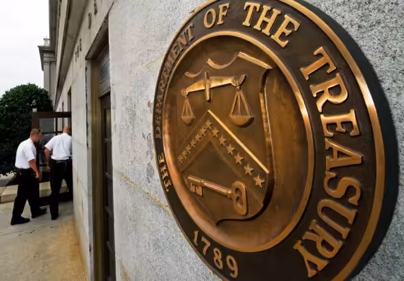 Entrance to the US Department of the Treasure with a closeup to its coat of arms. File photo.