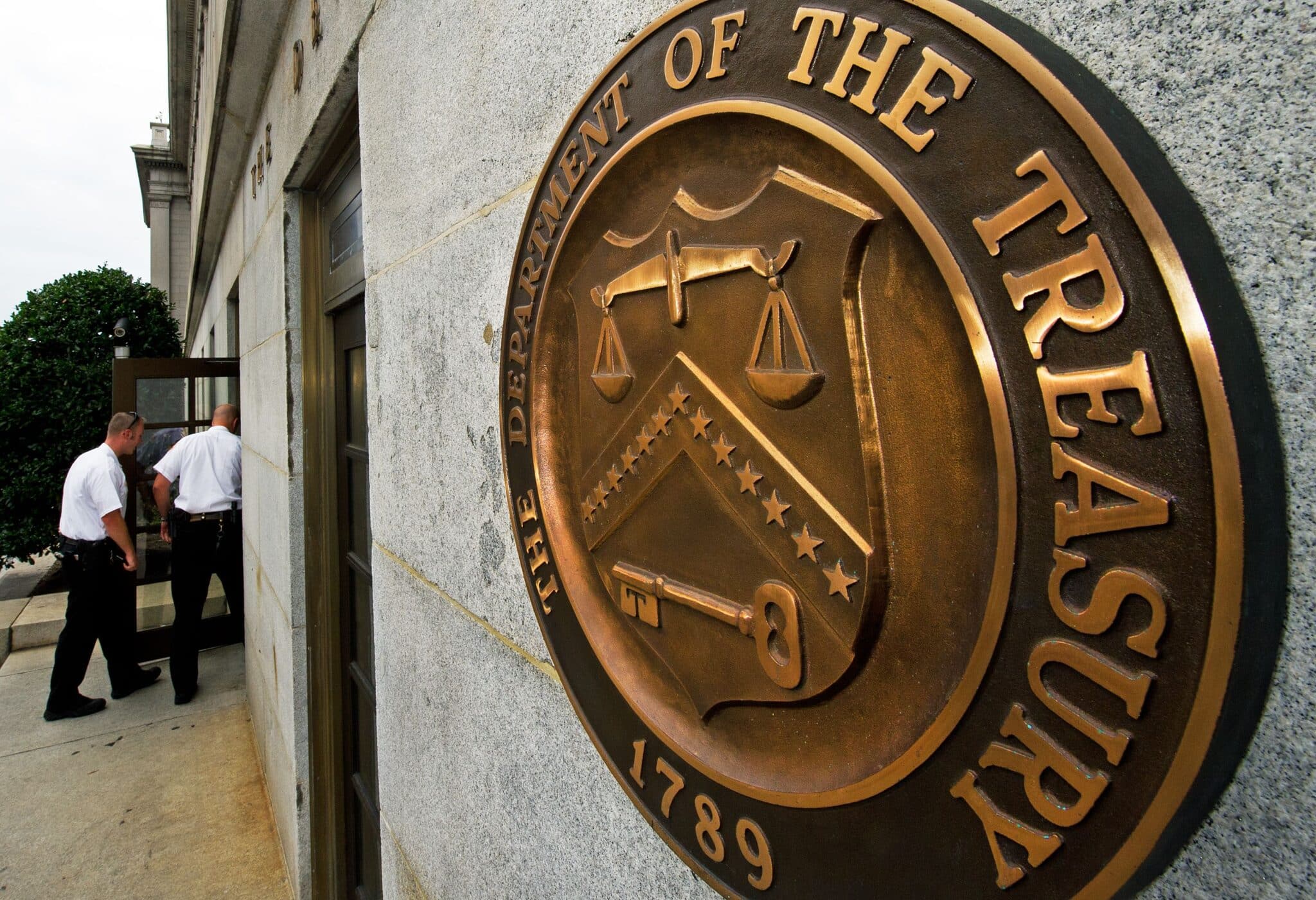 Entrance to the US Department of the Treasure with a closeup to its coat of arms. File photo.