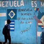 Street painting in Caracas showing a map of South America with the Mercosur countries and their flags. It reads "Venezuela is Mercosur." Photo: Reuters/Uslei Marcelino.