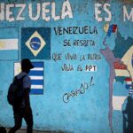 Street painting in Caracas showing a map of South America with the Mercosur countries and their flags. It reads "Venezuela is Mercosur." Photo: Reuters/Uslei Marcelino.
