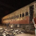 Godhra train wagon being inspected after the incident in 2002. AFP File Photo.