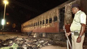 Godhra train wagon being inspected after the incident in 2002. AFP File Photo.