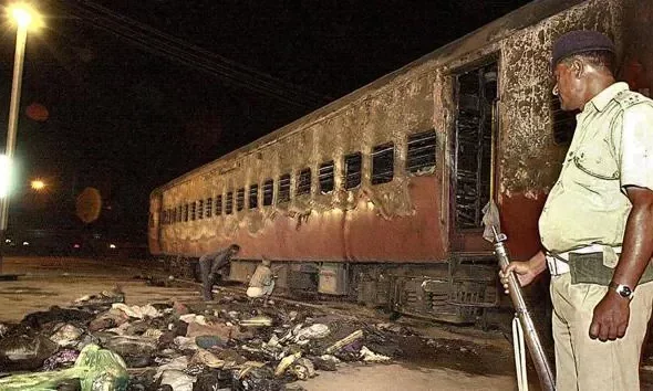 Godhra train wagon being inspected after the incident in 2002. AFP File Photo.