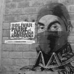 Street art showing Simon Bolivar wearing a balaclava next to a banner that reads: "Bolivar, father of the American Rebellion." Art: Comando Creativo.