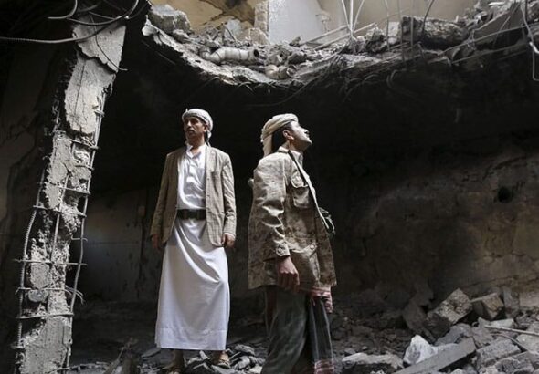 Houthi militants stand in the house of Houthi leader Yahya Aiydh, after Saudi-led air strikes destroyed it in Yemen's capital Sanaa September 8, 2015. Photo: Khaled Abdullah / Reuters