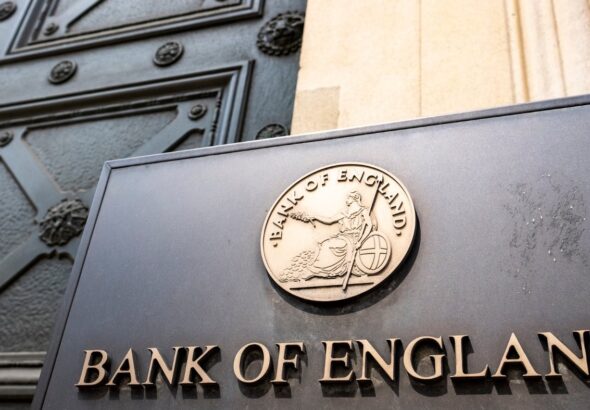Bank of England headquarters's entrance in London with a view of its logo. Photo: iea.org.uk.