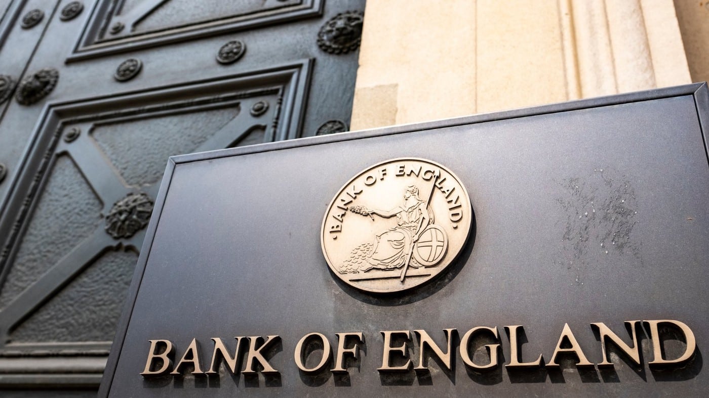 Bank of England headquarters's entrance in London with a view of its logo. Photo: iea.org.uk.