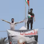 Palestinians take part in a rally in Gaza. Photo: Mahmoud Ajjour, The Palestine Chronicle.