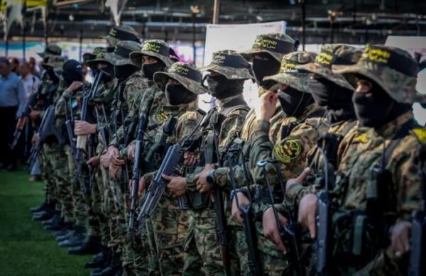Members of Al-Quds Brigades, the military wing of the Islamic Jihad movement at a gathering for Islamic Jihad commander Khaled Mansour, who was killed on the first day of “Operation Breaking Dawn”, in Rafah, in the southern Gaza Strip, on August 8, 2022 (photo credit: ABED RAHIM KHATIB/FLASH90)