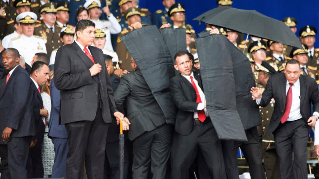 Seconds after the first drone explosion, while the presidential security detail was evacuating President Maduro from the stage during the assassination attempt. File photo.