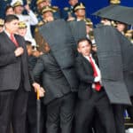 Seconds after the first drone explosion, while the presidential security detail was evacuating President Maduro from the stage during the assassination attempt. File photo.