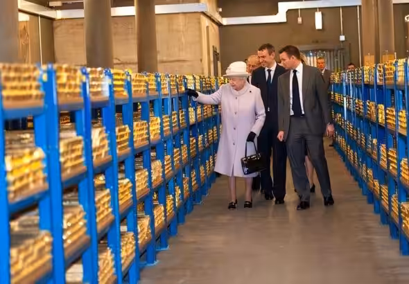 Queen Elizabeth II views stacks of gold during her visit to the Bank of England with Prince Philip, Duke of Edinburgh, on December 13, 2012, in London, England. Photo: Getty Images.