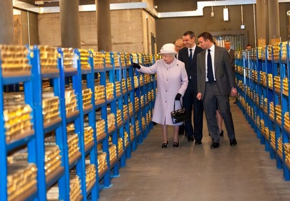 Queen Elizabeth II views stacks of gold during her visit to the Bank of England with Prince Philip, Duke of Edinburgh, on December 13, 2012, in London, England. Photo: Getty Images.