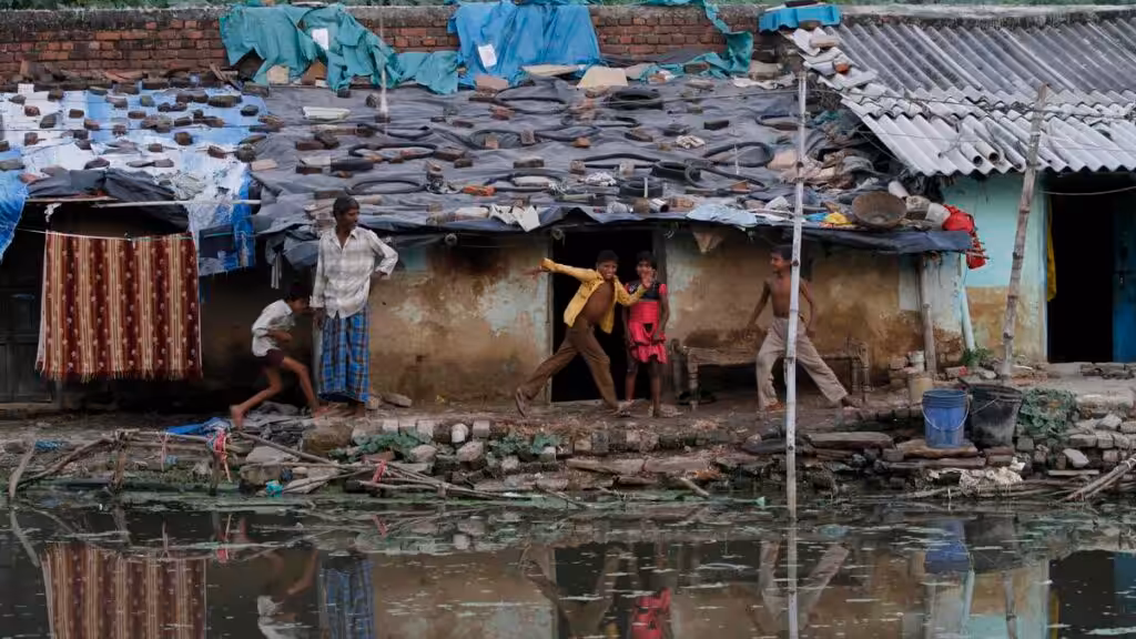 Children playing in a slum in Allahabad, India, October 3, 2011. Photo: AP.