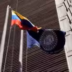 Venezuela's Central Bank (BCV) headquarters in Caracas next to BCV and Venezuelan flags. File photo.