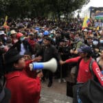 An Ecuadorian protest leader addresses some demonstrators with a megaphone. File photo.