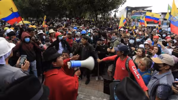 An Ecuadorian protest leader addresses some demonstrators with a megaphone. File photo.